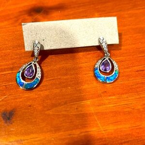 These precious stones Australian opal and tanzanite purple. Brought in Hawaii.